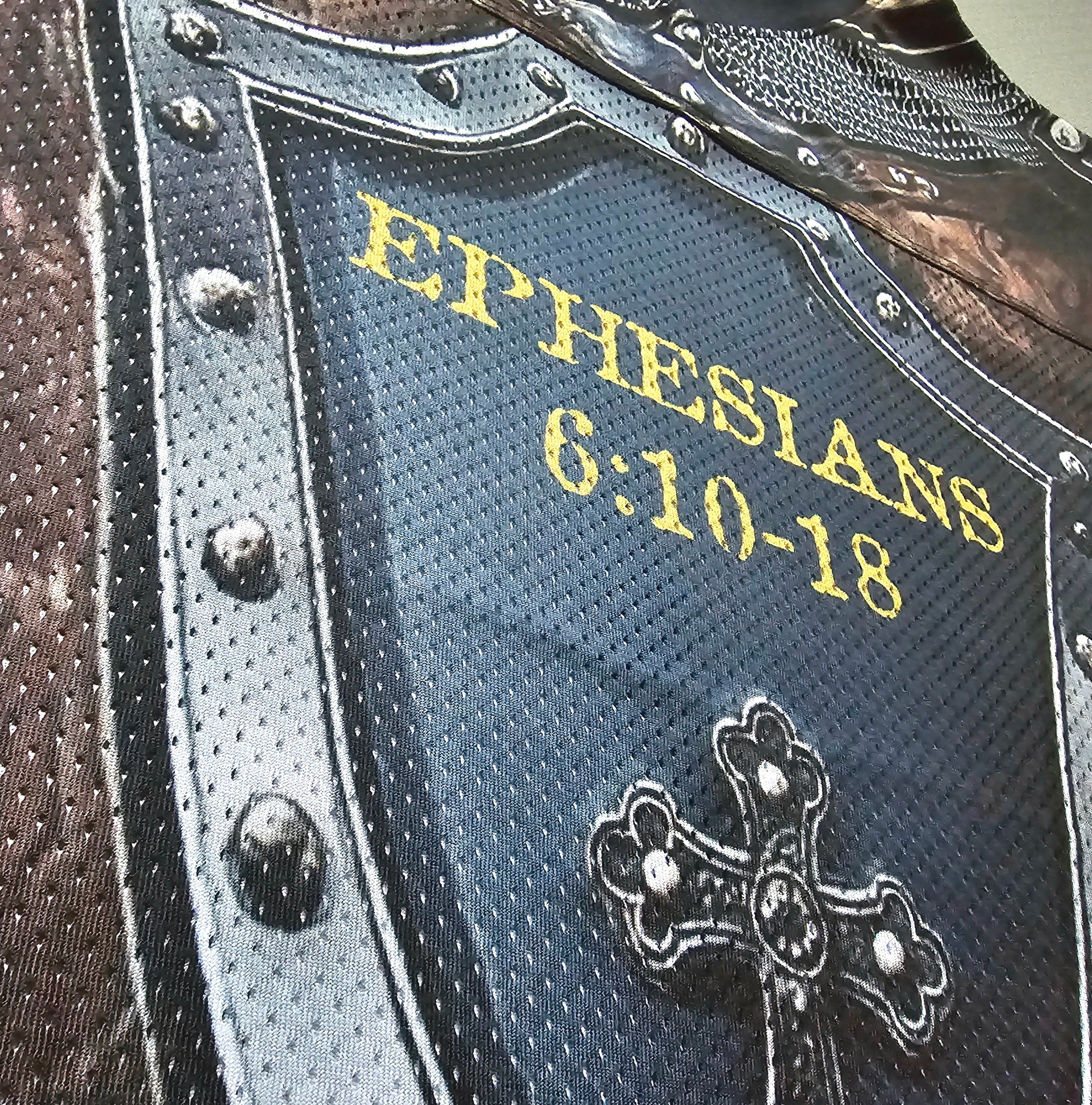 Text 'EPHESIANS 6:10-18' on a decorative shield with cross designed football jersey.