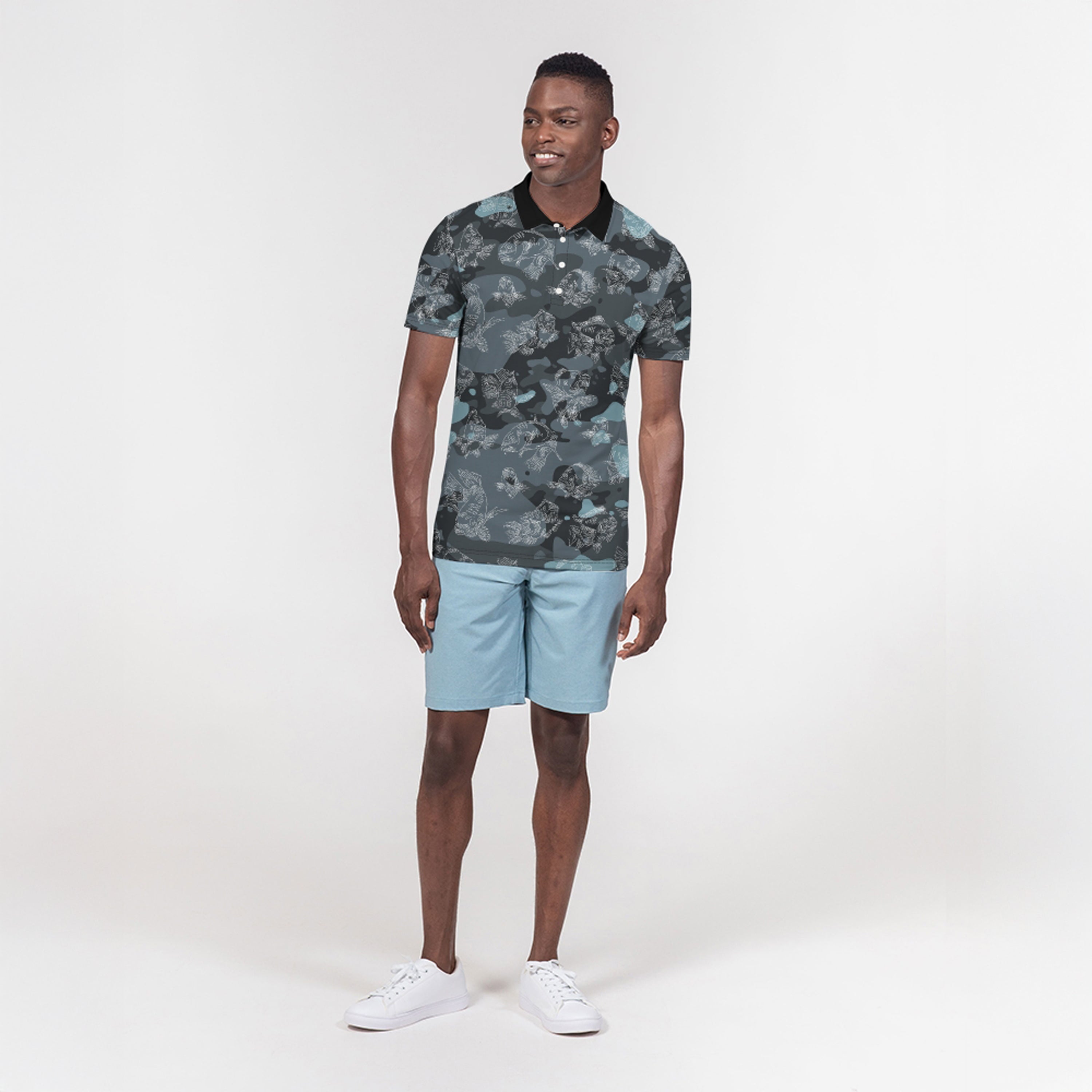 Full image of man wearing a camouflage polo shirt and light blue shorts on a white background