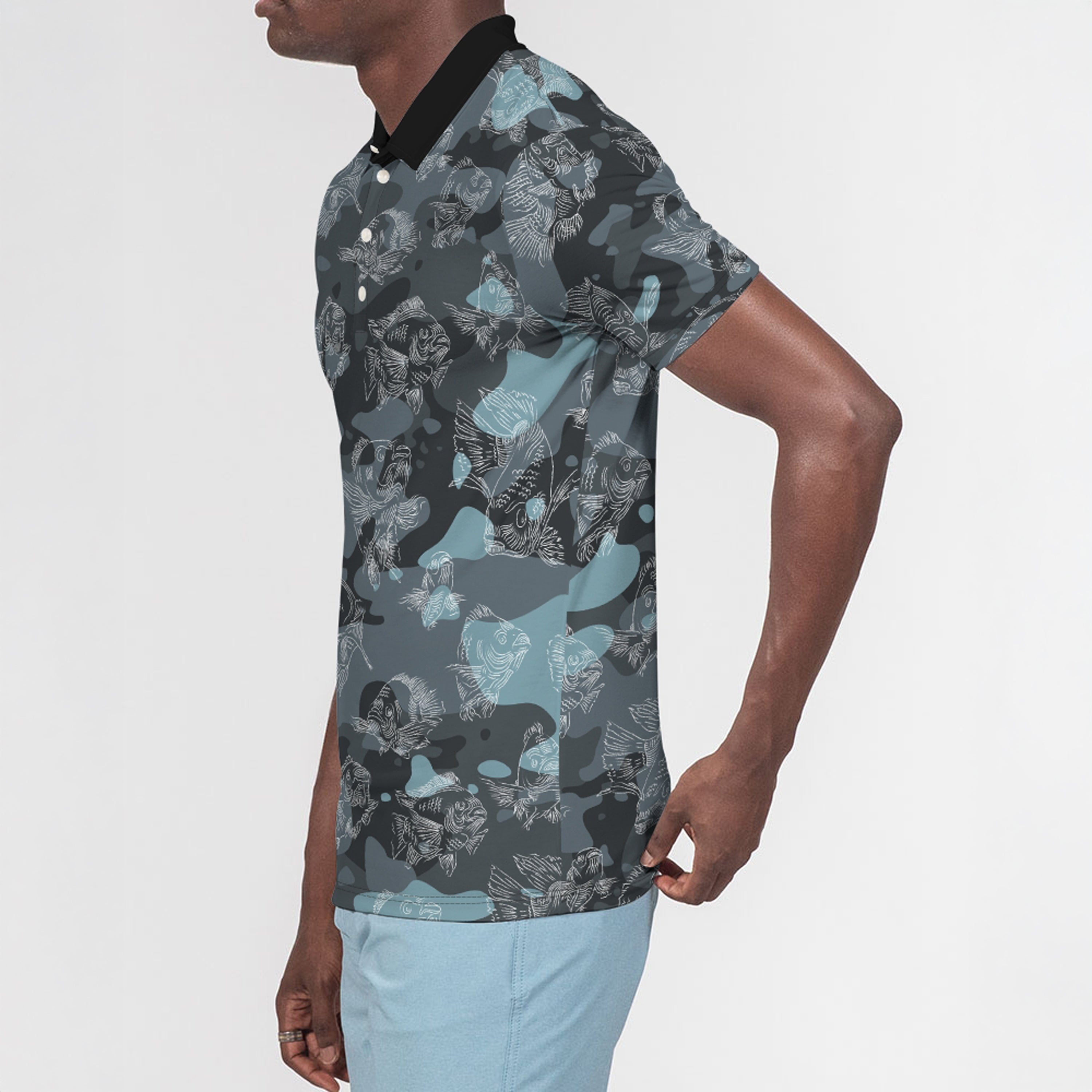 Left side of man wearing a patterned shirt with a neutral background