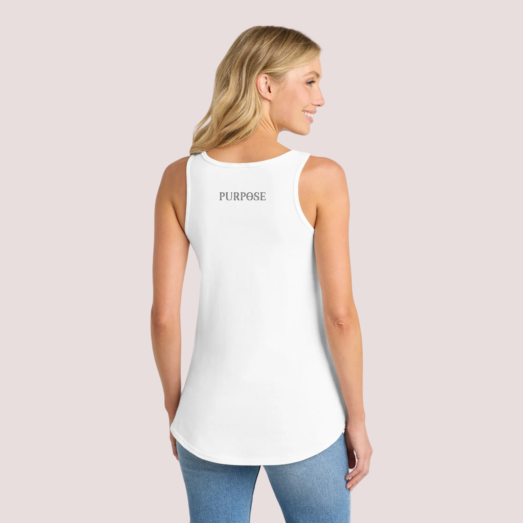 Woman wearing a white tank top with 'PURPOSE' text on a pale background