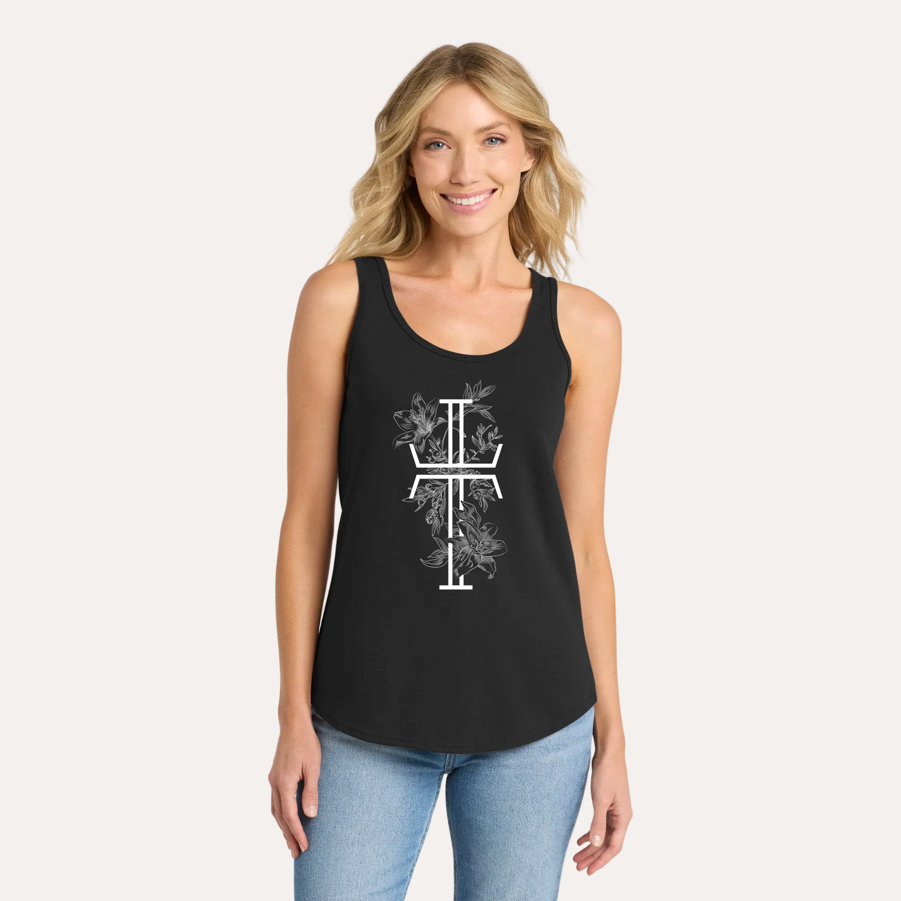Woman wearing a black tank top with a white cross design on a white background