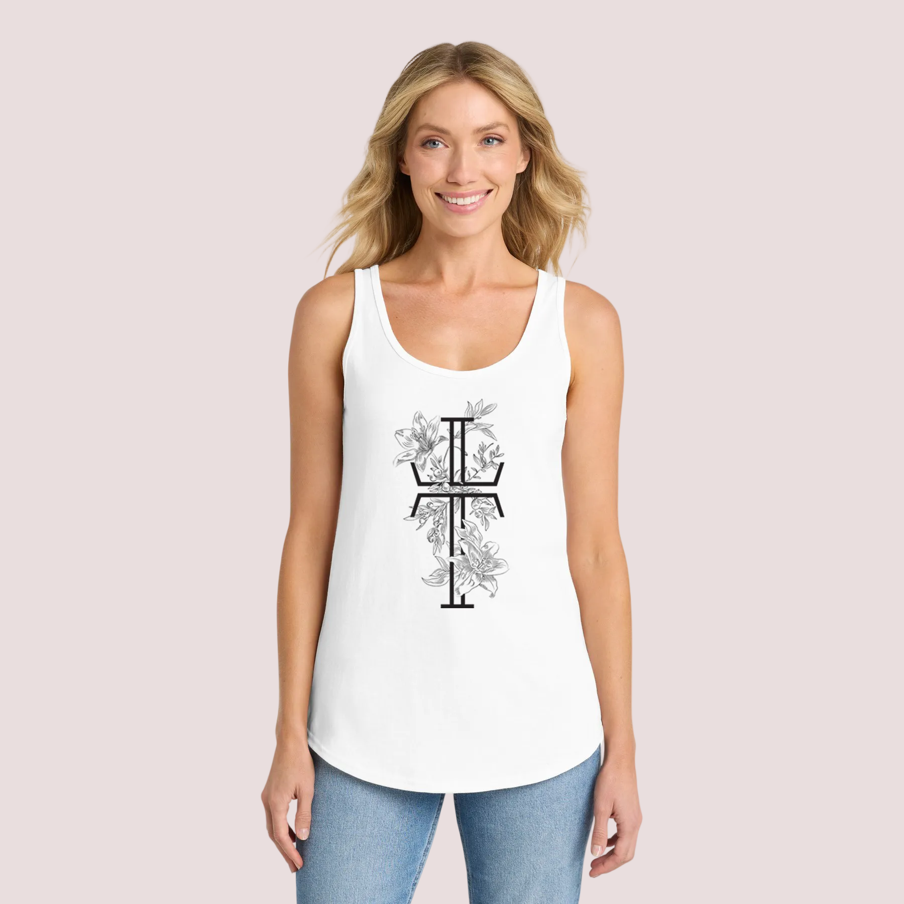 Woman wearing a white tank top with a black floral Christian cross on a pale background