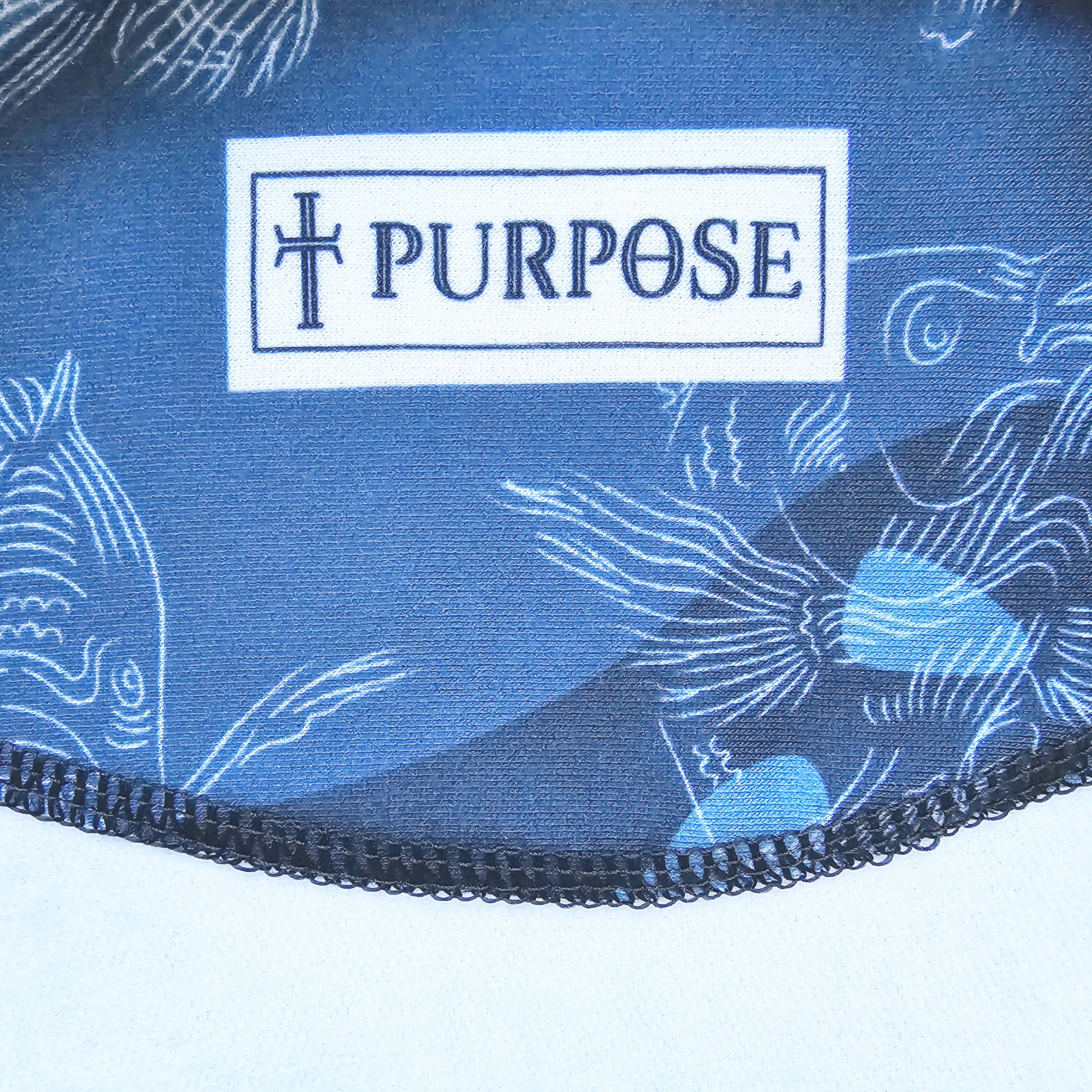 Blue fabric with white fish patterns and 'PURPOSE' logo on a white background