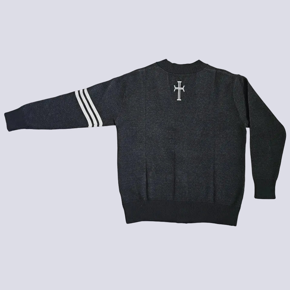 A dark gray heather knit sweater shown from the back, featuring a white cross centered on the upper back and three white stripes on one sleeve, laid flat against a light gray background.