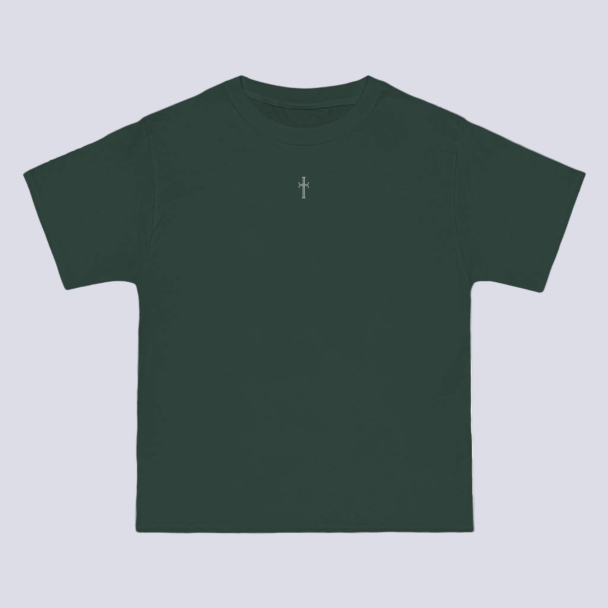 A forest green crewneck tee shirt displays the front of the garment. A small white cross logo is printed at the top center.