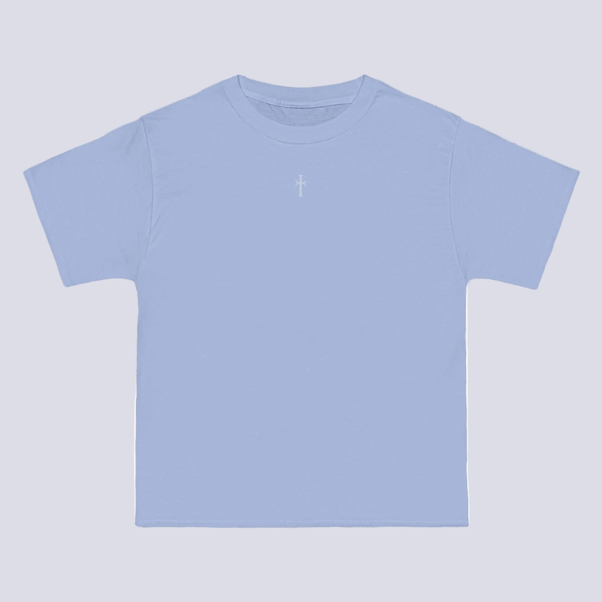 A light blue crewneck tee shirt displays the front of the garment. A small white cross logo is printed at the top center.