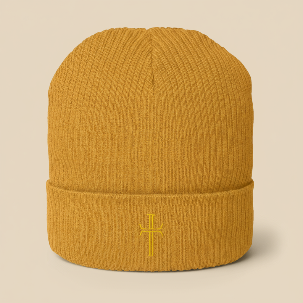 Mustard-colored knit beanie with embroidered crucifix