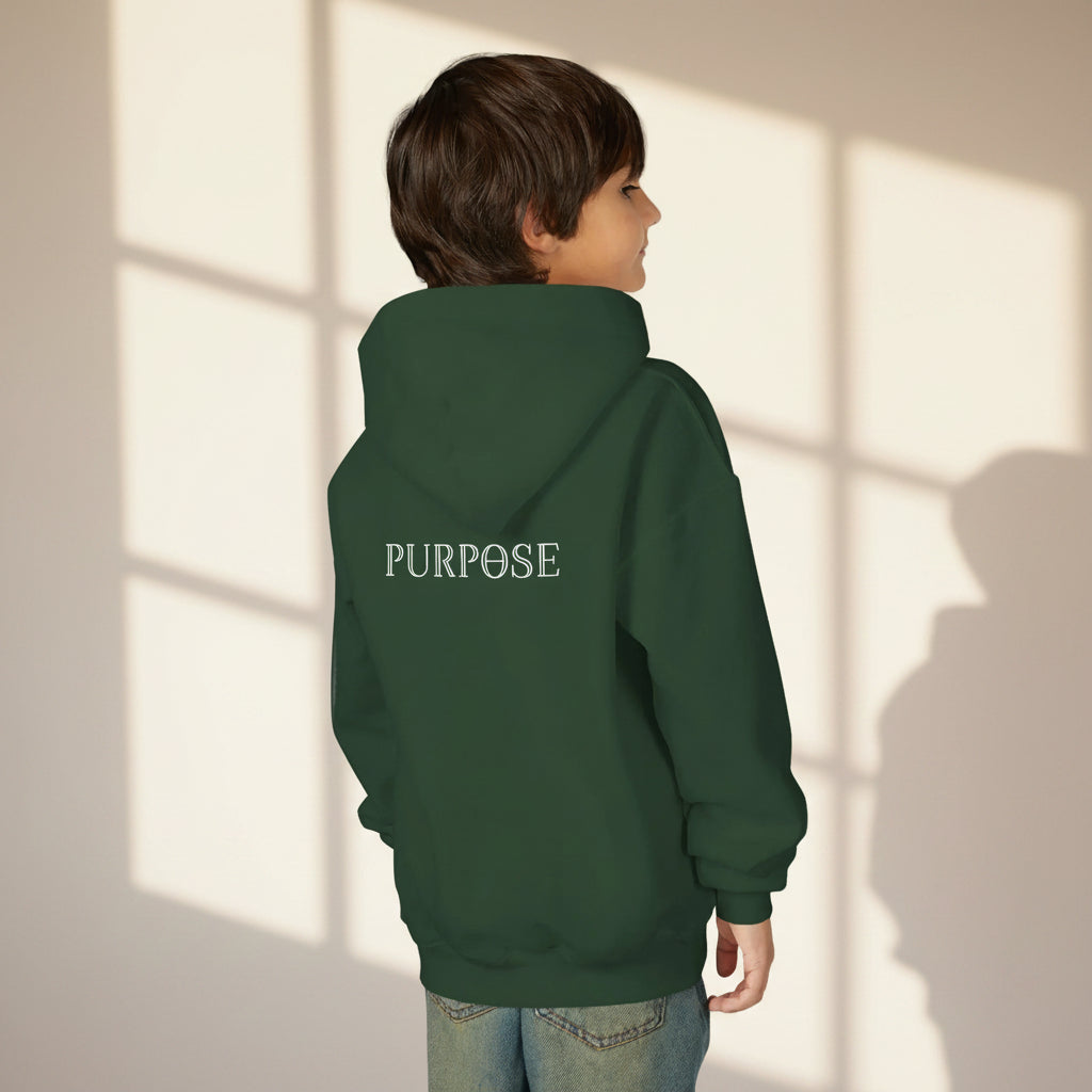 Child wearing a dark green hoodie with 'Purpose' text on the back against a light background