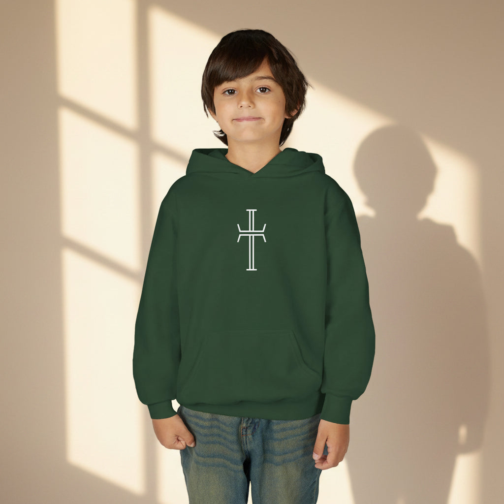 Child wearing a dark green hoodie with a cross on the center chest