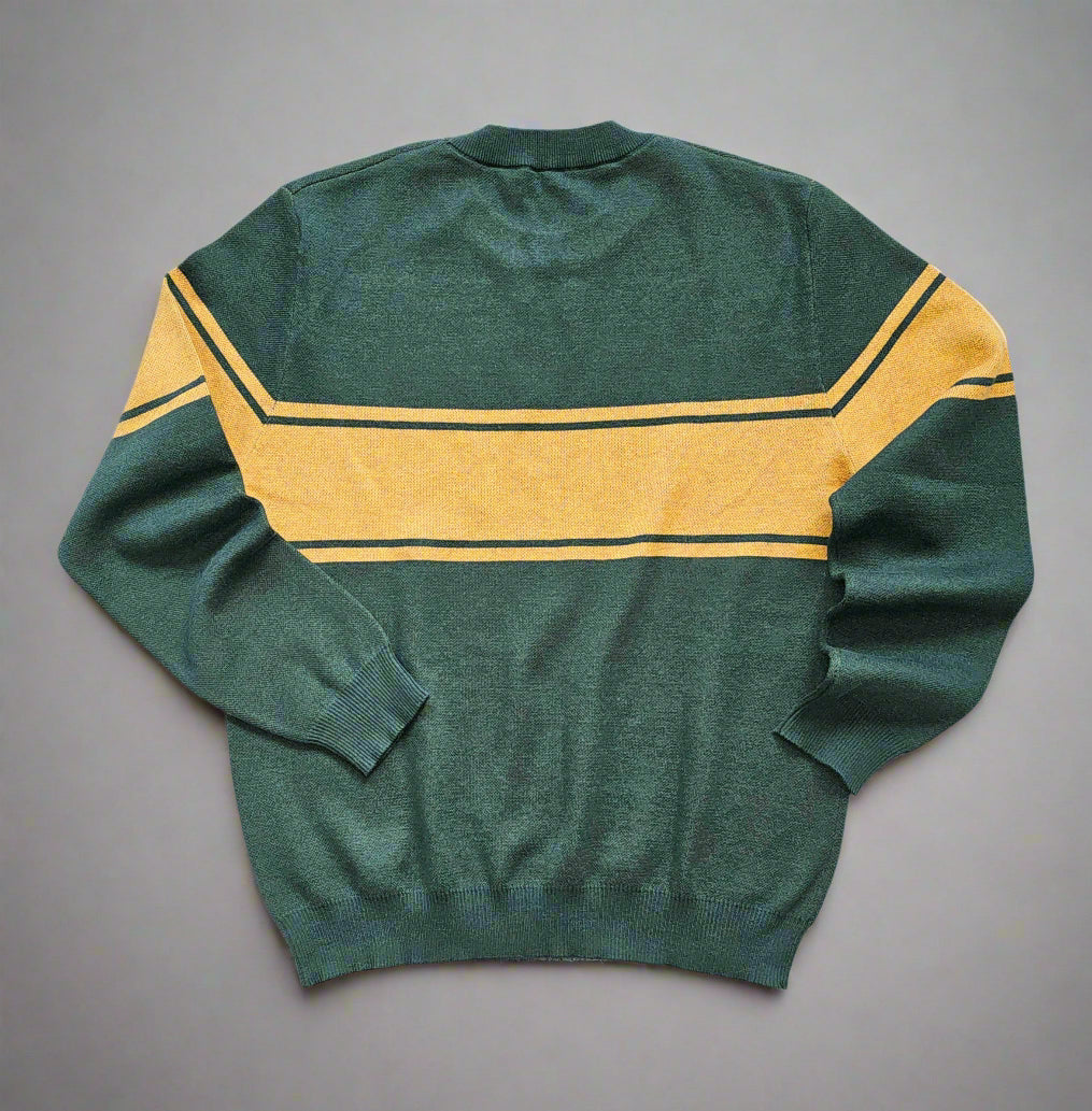 The back of the forest green sweater laying against a white background. The three stripes in a mustard-yellow color are continuing across the upper back and arms.