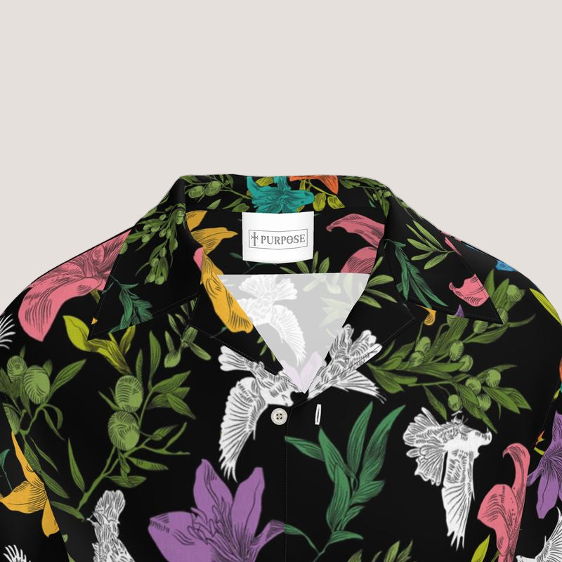 Floral and nature-themed shirt with a brand label on a light gray background
