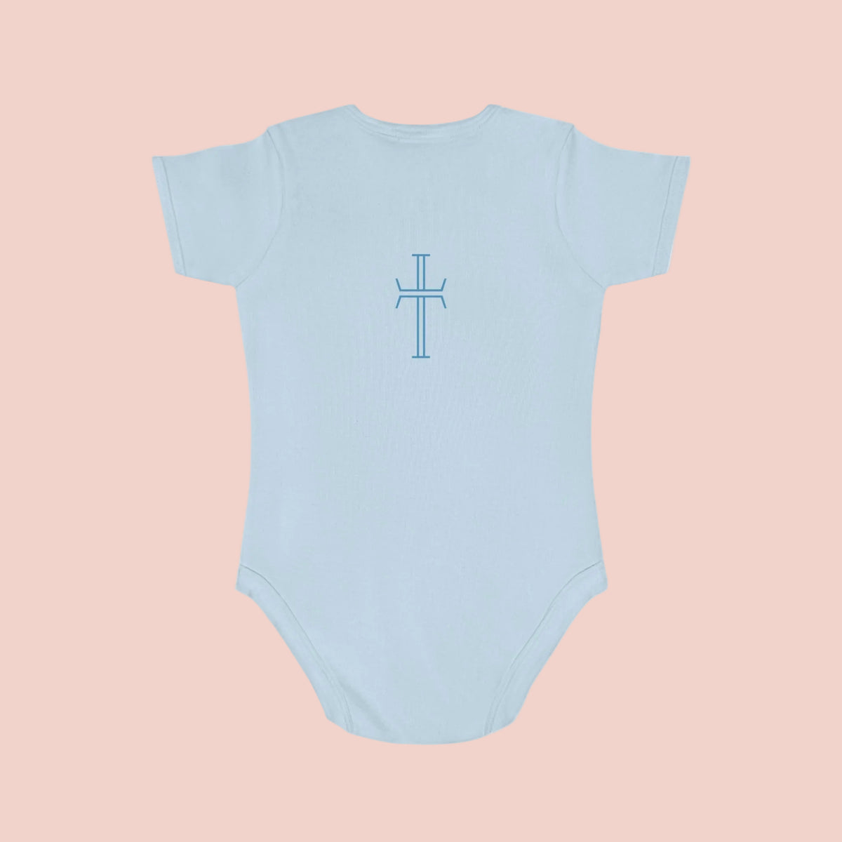 Light blue baby onesie with a cross design on a pale background