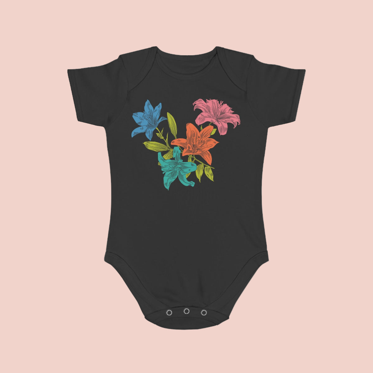 Black baby onesie with colorful floral design on a pink background