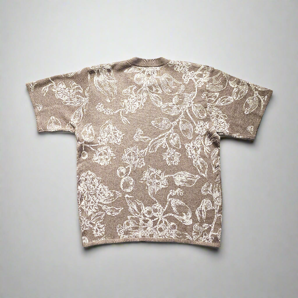 Floral patterned knitted tee on a plain background