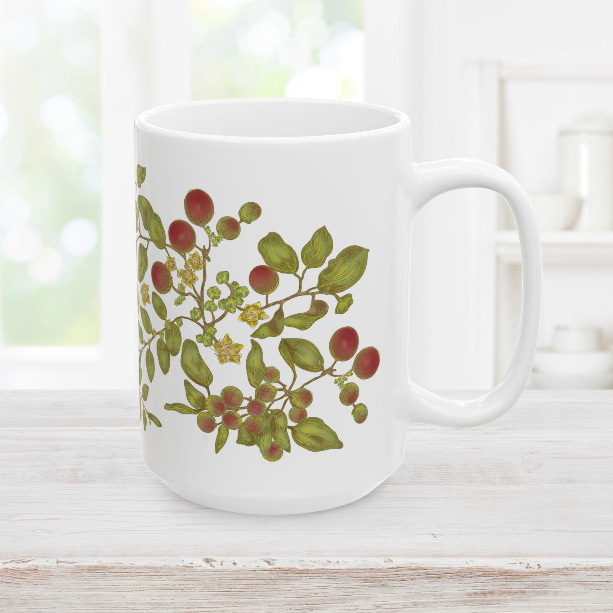 Left side of white mug with floral, berry, and leaf design on a wooden surface.