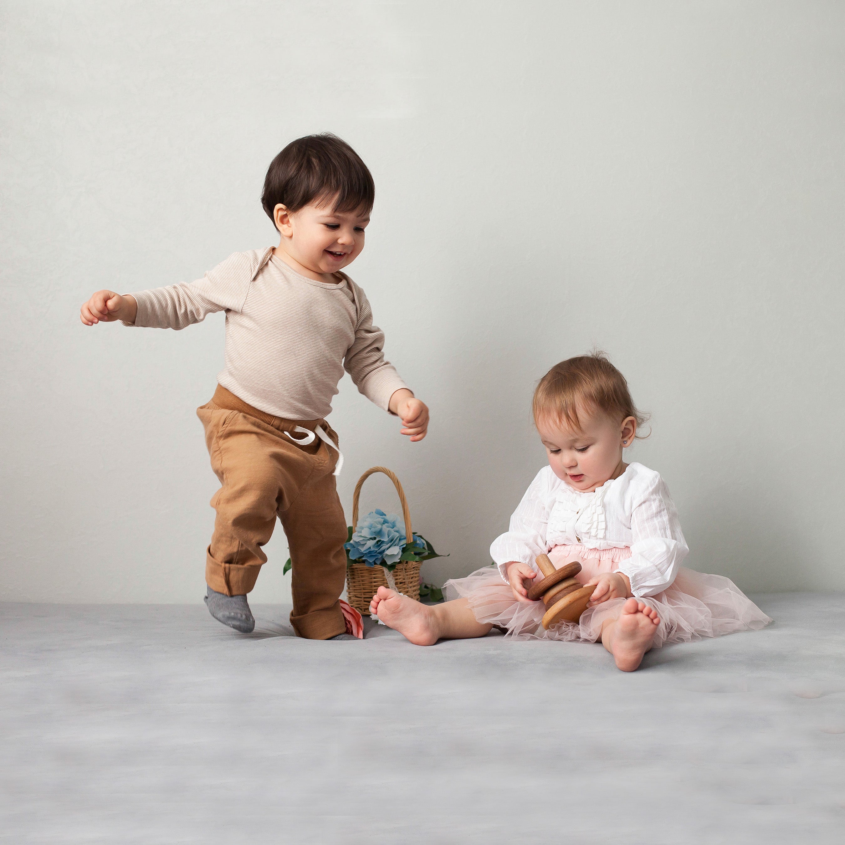 Boy and girl toddlers play together.