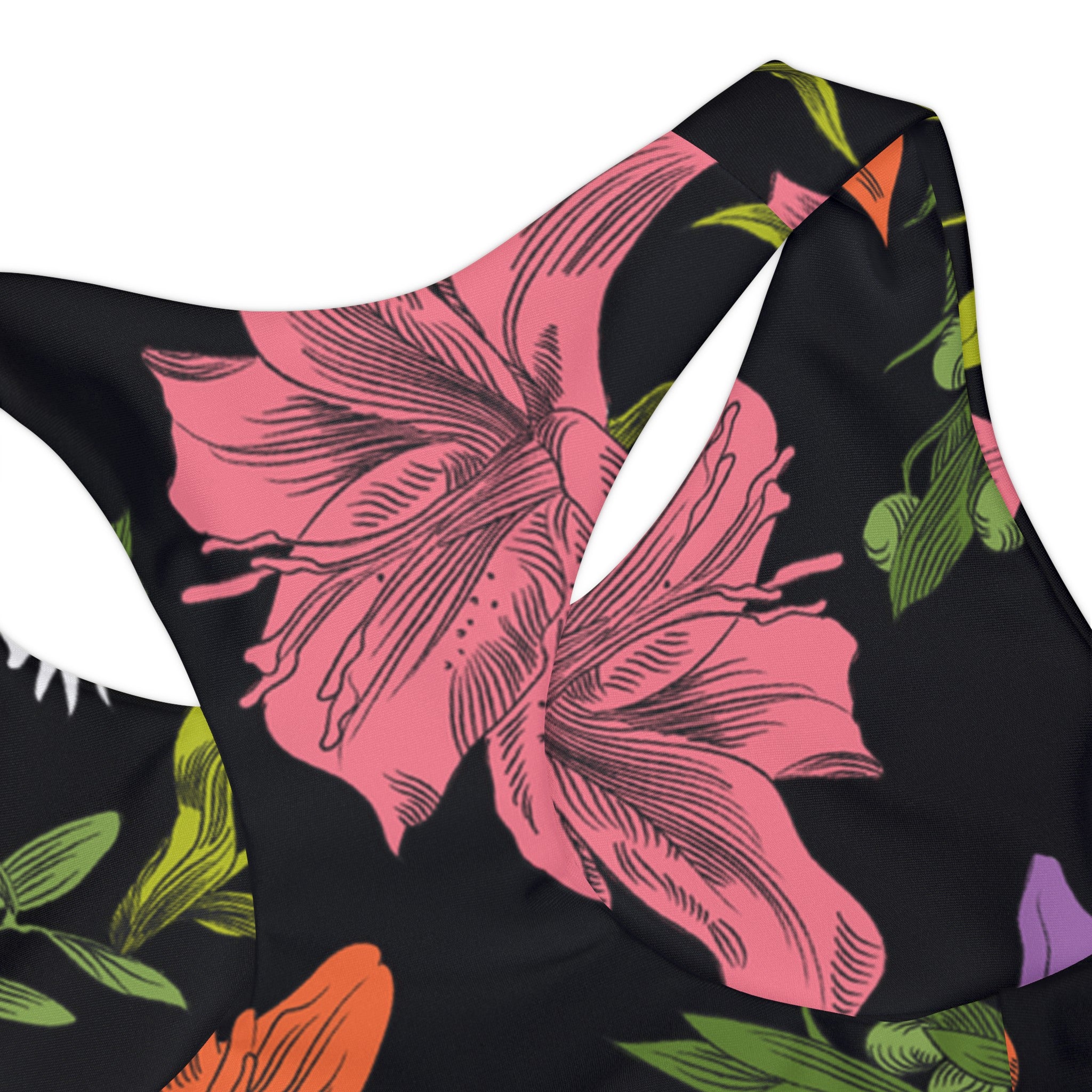 Close-up of the back of the tank swim top showing construction and the finer details of the all-over, multi-colored pattern with flowers, olive branches, and doves.