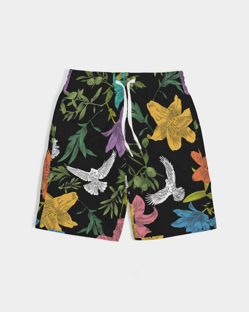 Black board shorts with an all-over, multi-colored pattern of flowers, olive branches, and doves, has white external ties and elastic waistband.