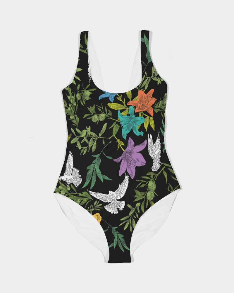 Front view of a black, one-piece, scoop-neck swimsuit with doves, flowers, and olive branches, creating a bold, multi-colored, all-over printed pattern. The swimsuit is laying flat against a white background.