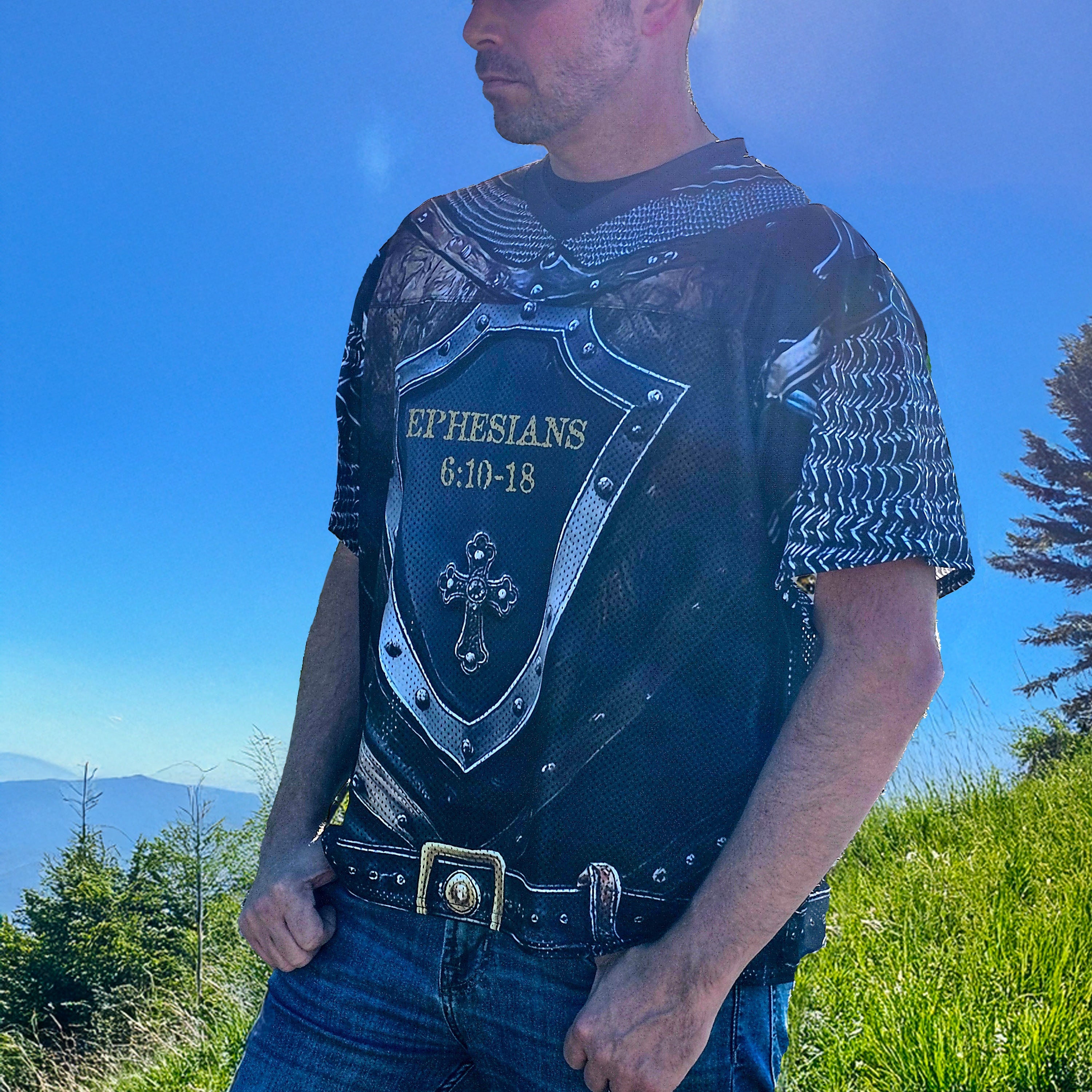Man wearing a decorative football jersey with religious text outdoors