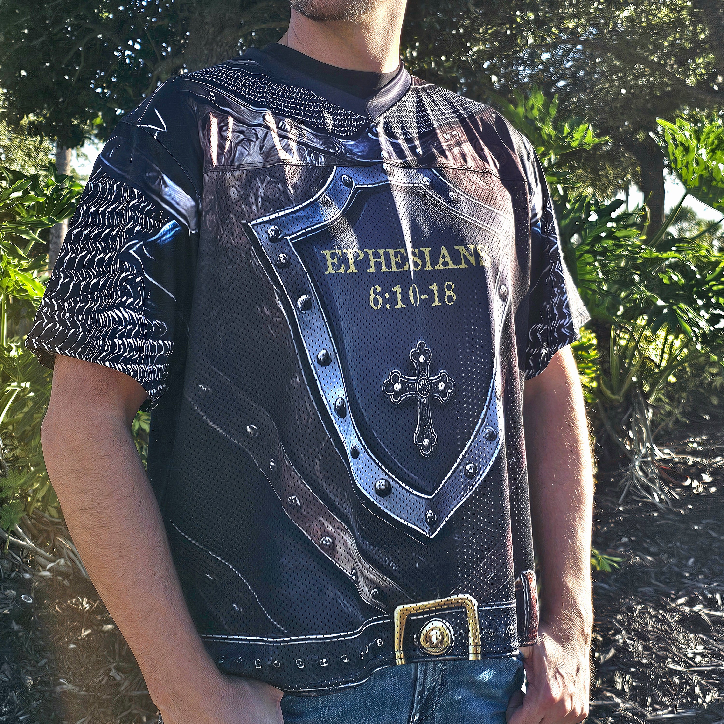 Person wearing a decorative shirt with armor-like design and 'Ephesians 6:10-18' text.
