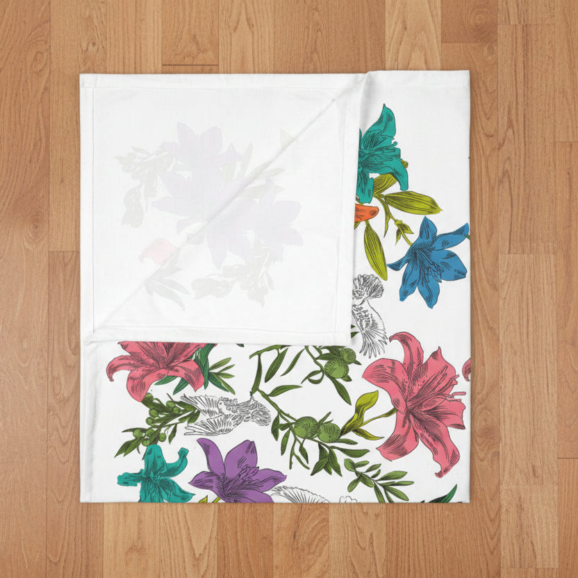 Floral and dove patterned blanket with colorful flowers on a white background