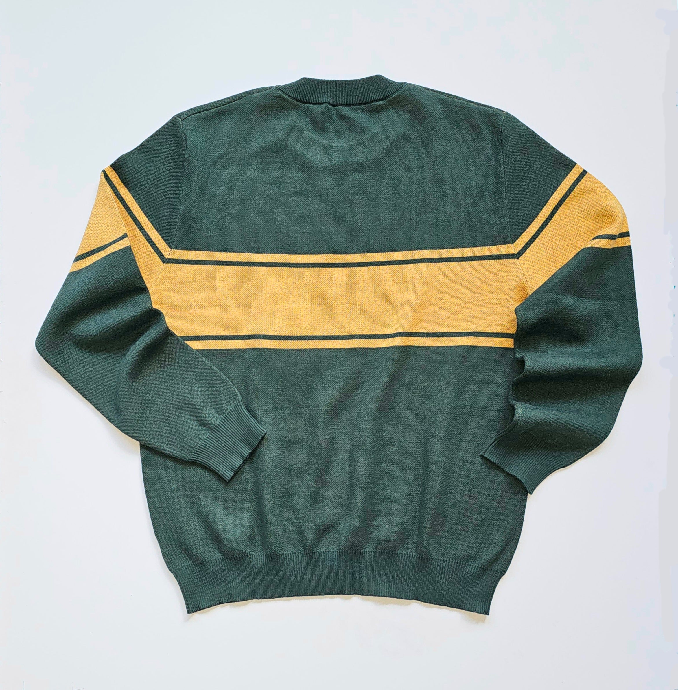 The back of the forest green sweater laying against a white background. The three stripes in a mustard-yellow color are continuing across the upper back and arms.