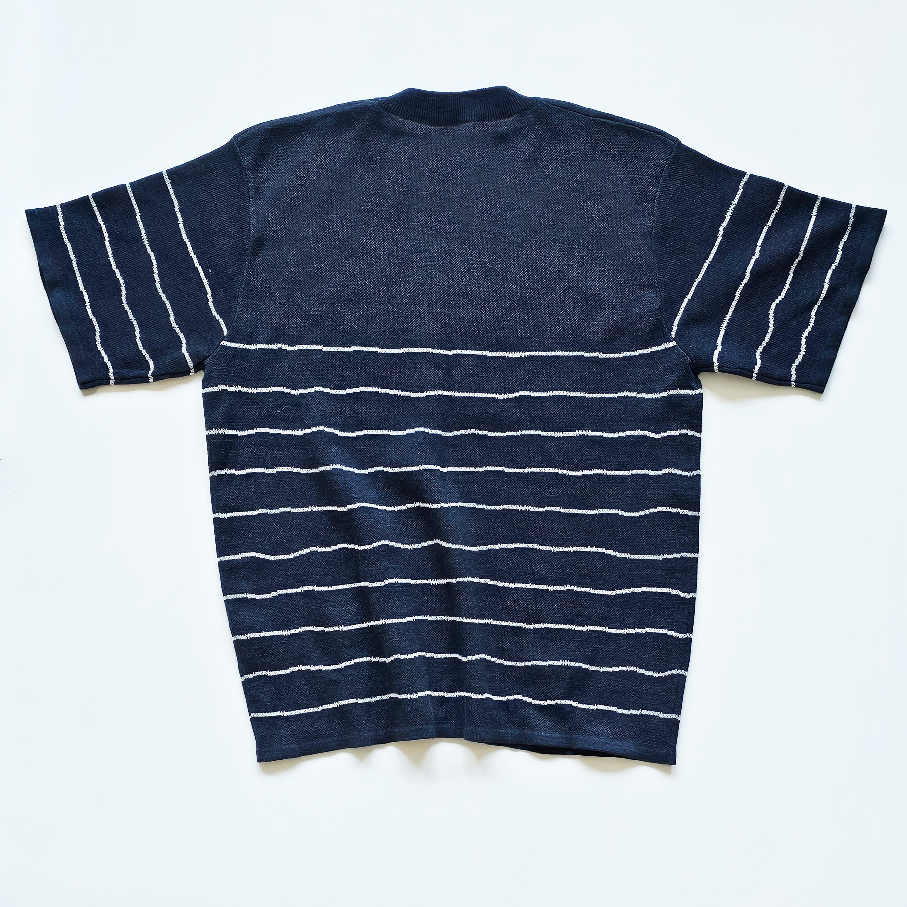 Navy blue t-shirt with white stripes on a white background