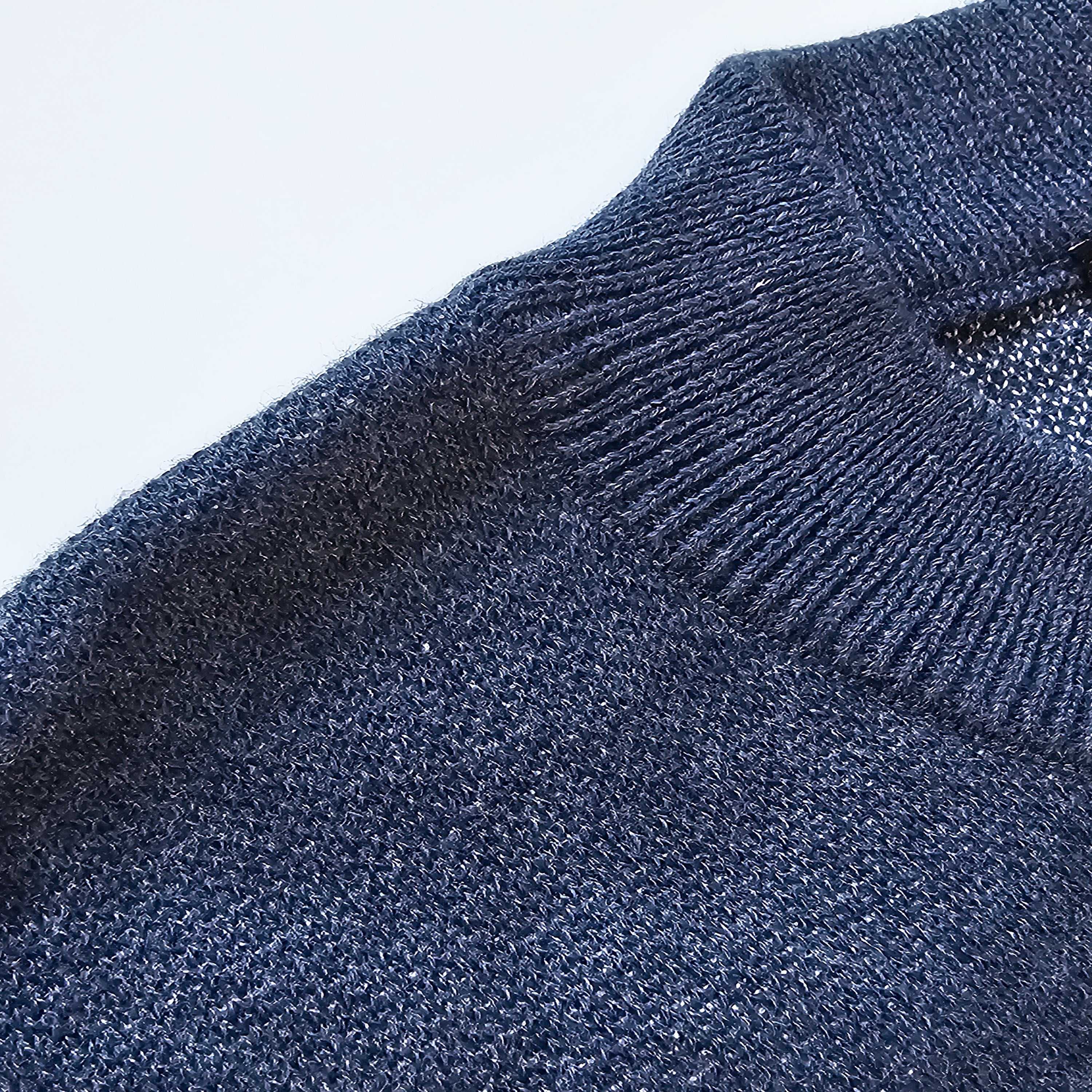 Close-up of a blue knit texture on a white background