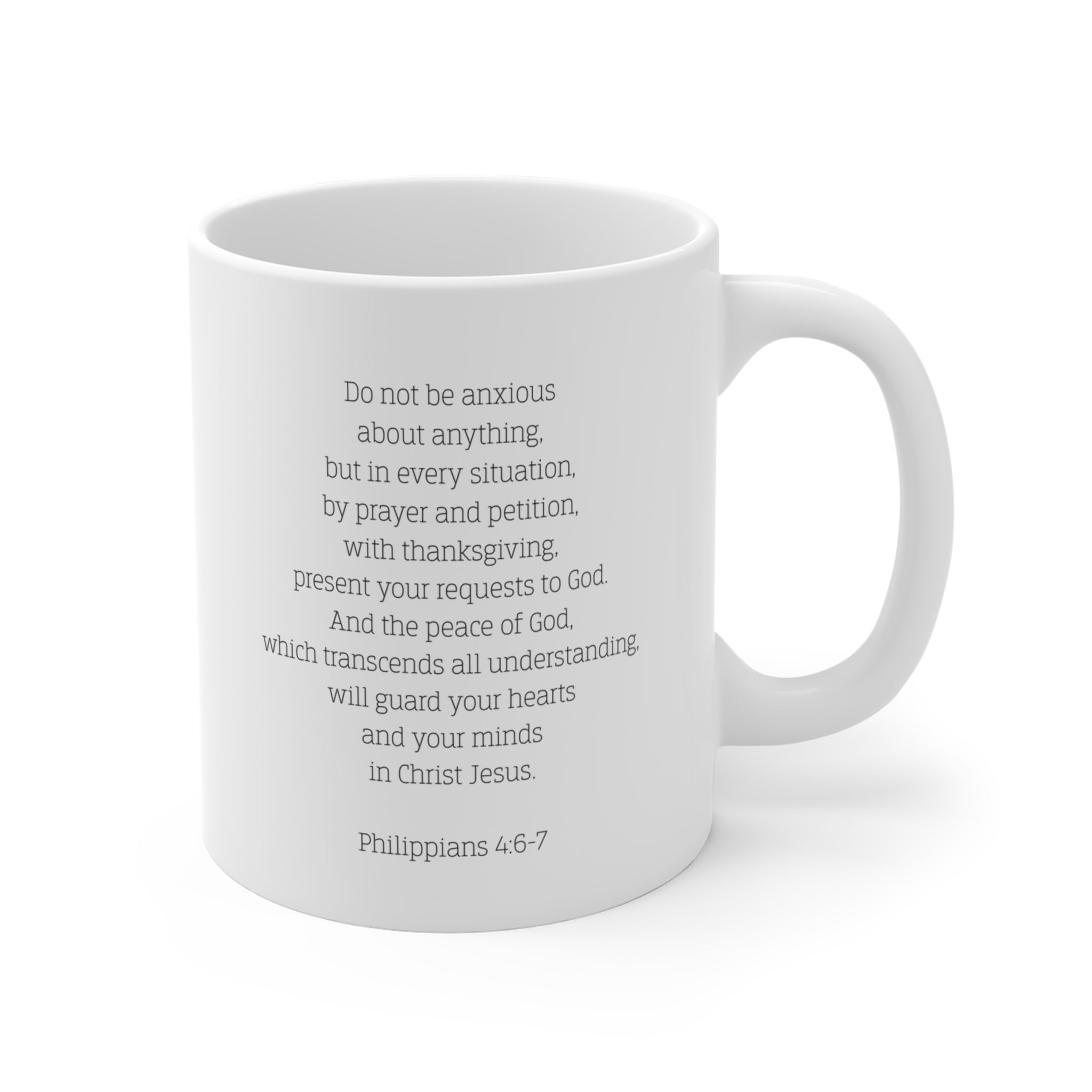 Back of white mug with the Biblical verse Philippians 4:6-7 typed on the back against a white background.