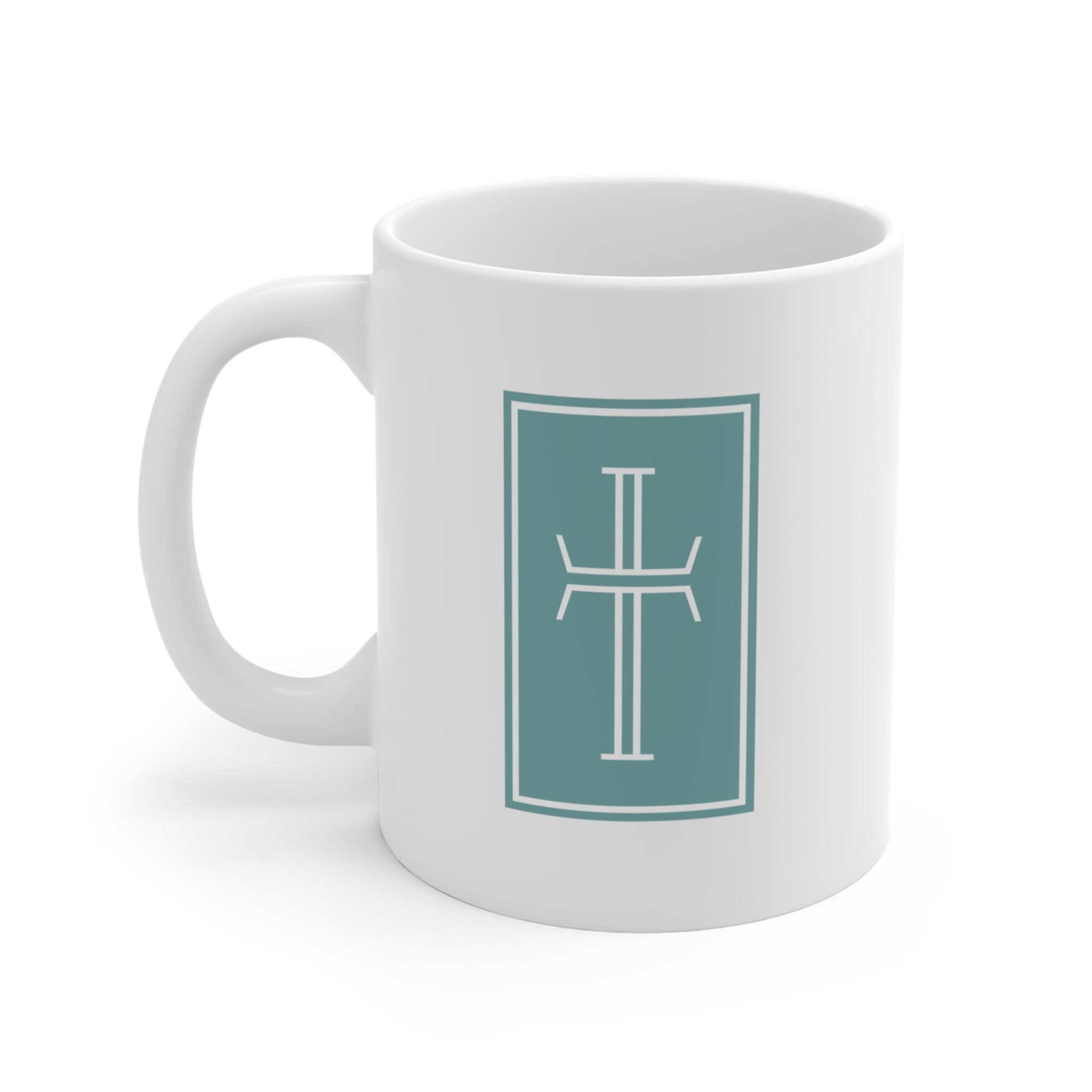 Front of a white mug displaying a white cross against a stormy-blue background.