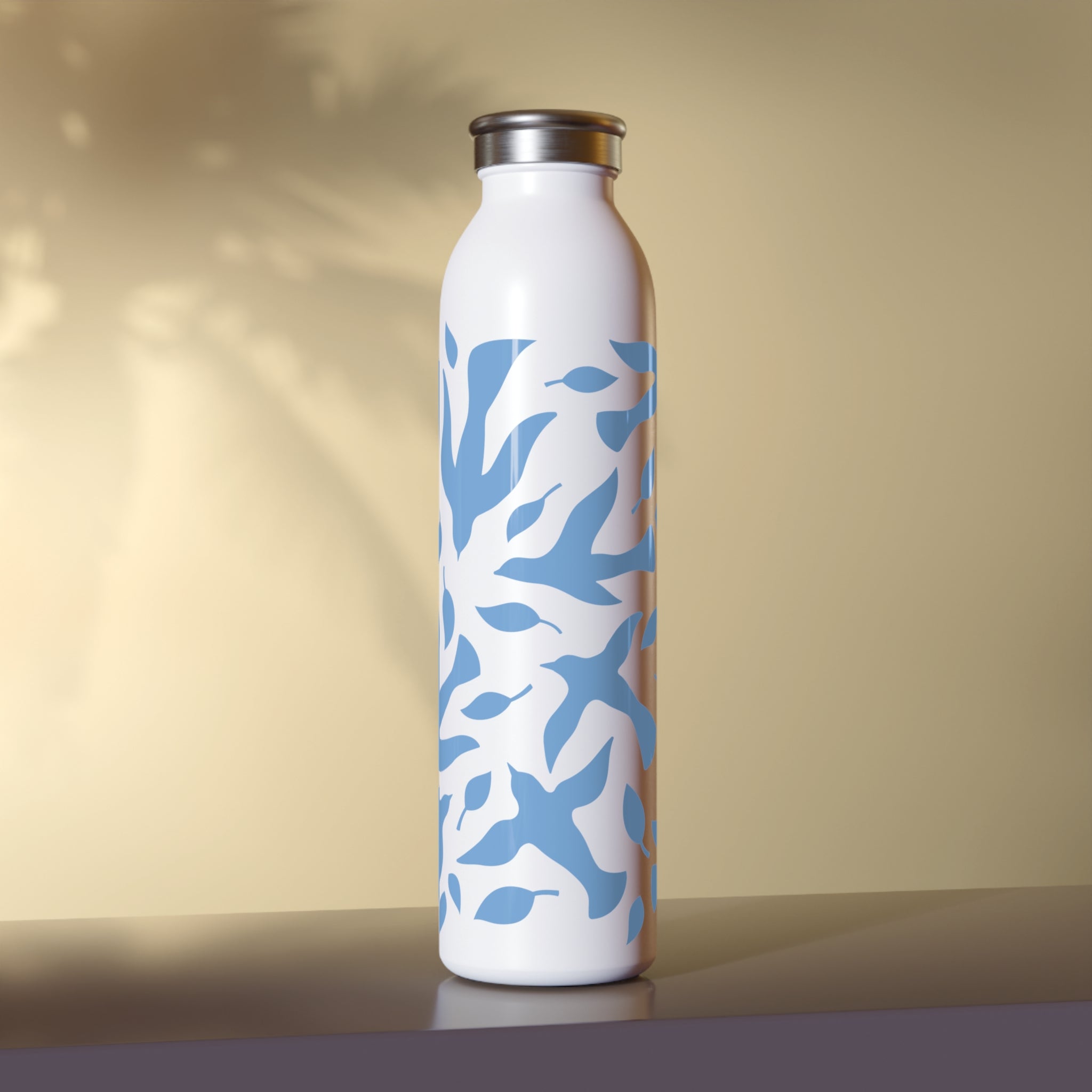 White water bottle with blue dove pattern on a beige background