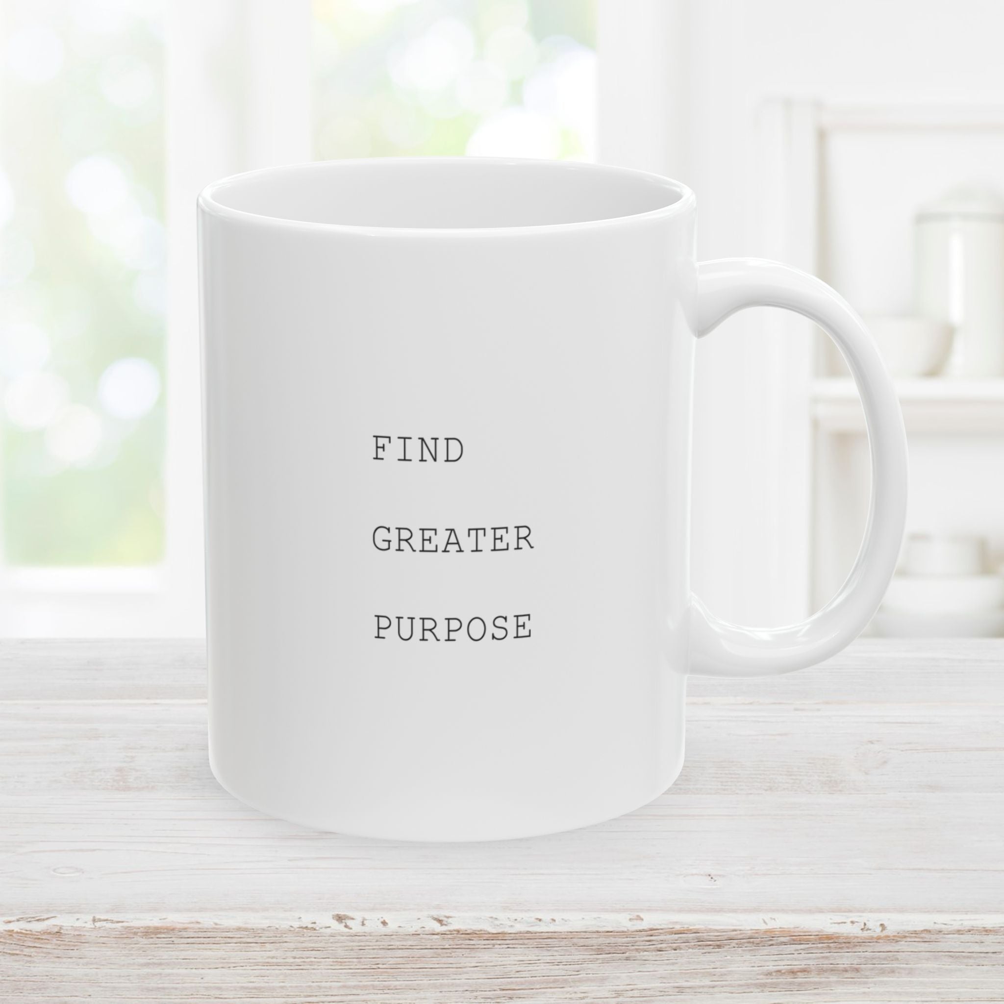Left side of 11oz white mug with 'Find Greater Purpose' text on a light wooden surface.