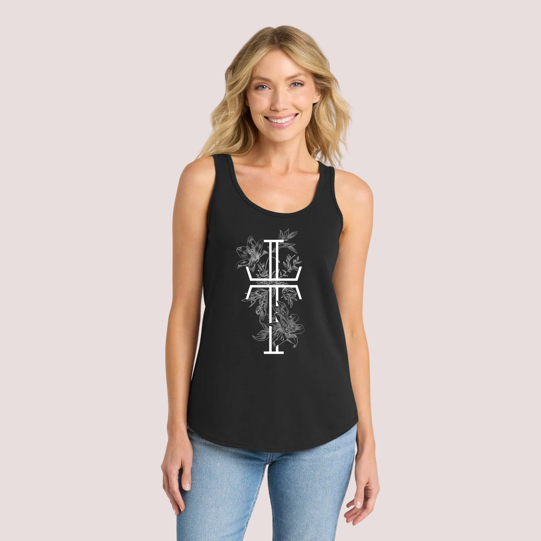 Woman wearing a black tank top with a white Christian cross design on a pale background