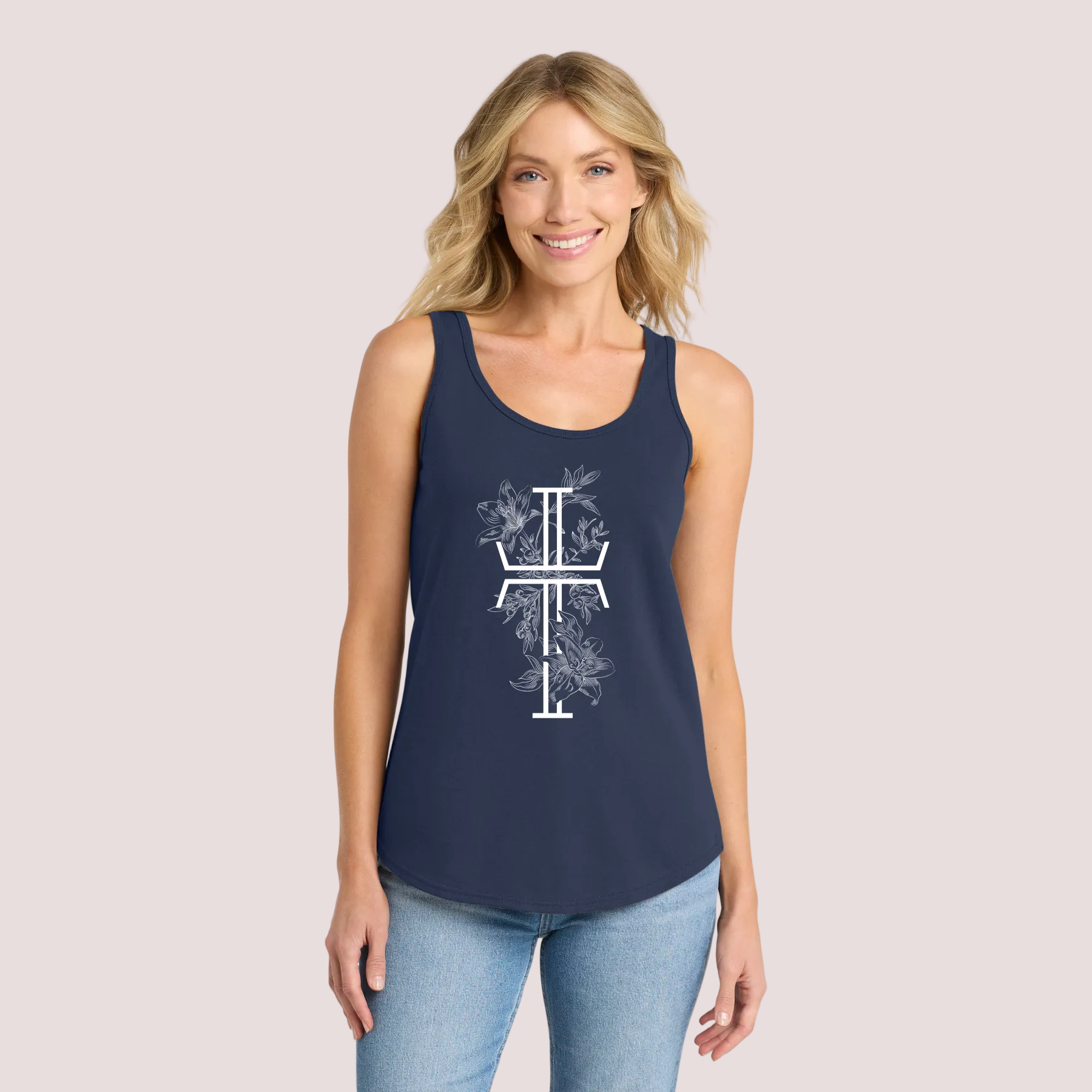 Woman wearing a navy tank top with a white floral Christian cross on a pale background