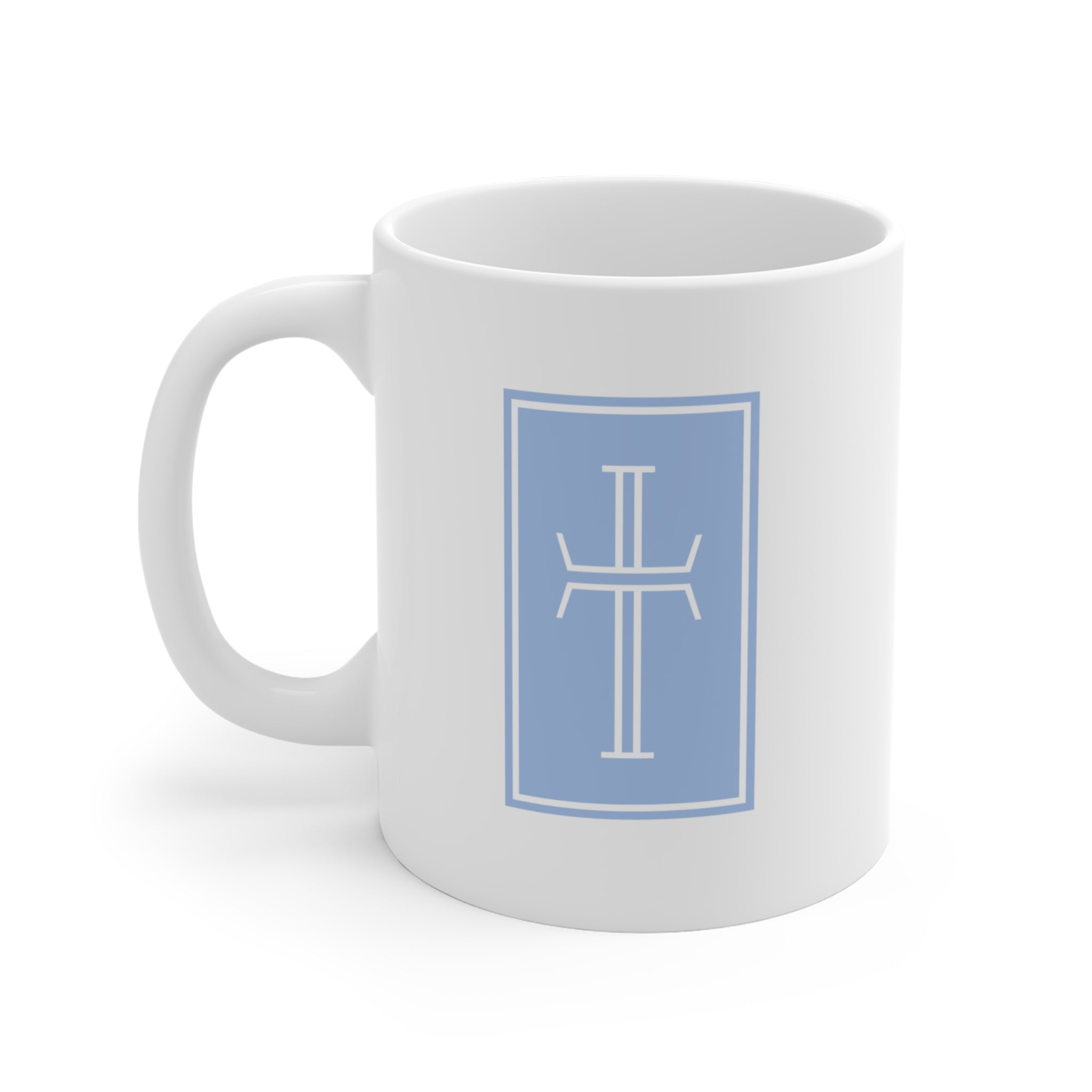 Front of a white mug displaying a white cross against a milky chalcedony background.
