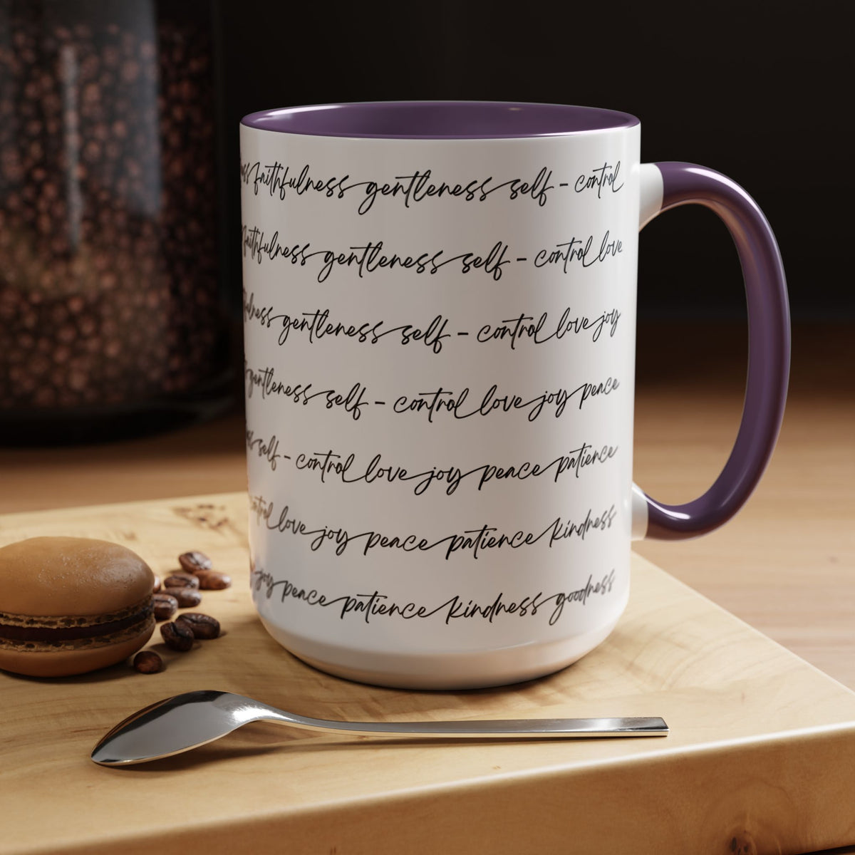 Right side of 15oz mug with purple interior and handle with black scripted text written on a white background sitting on a wooden surface with coffee beans and a spoon.