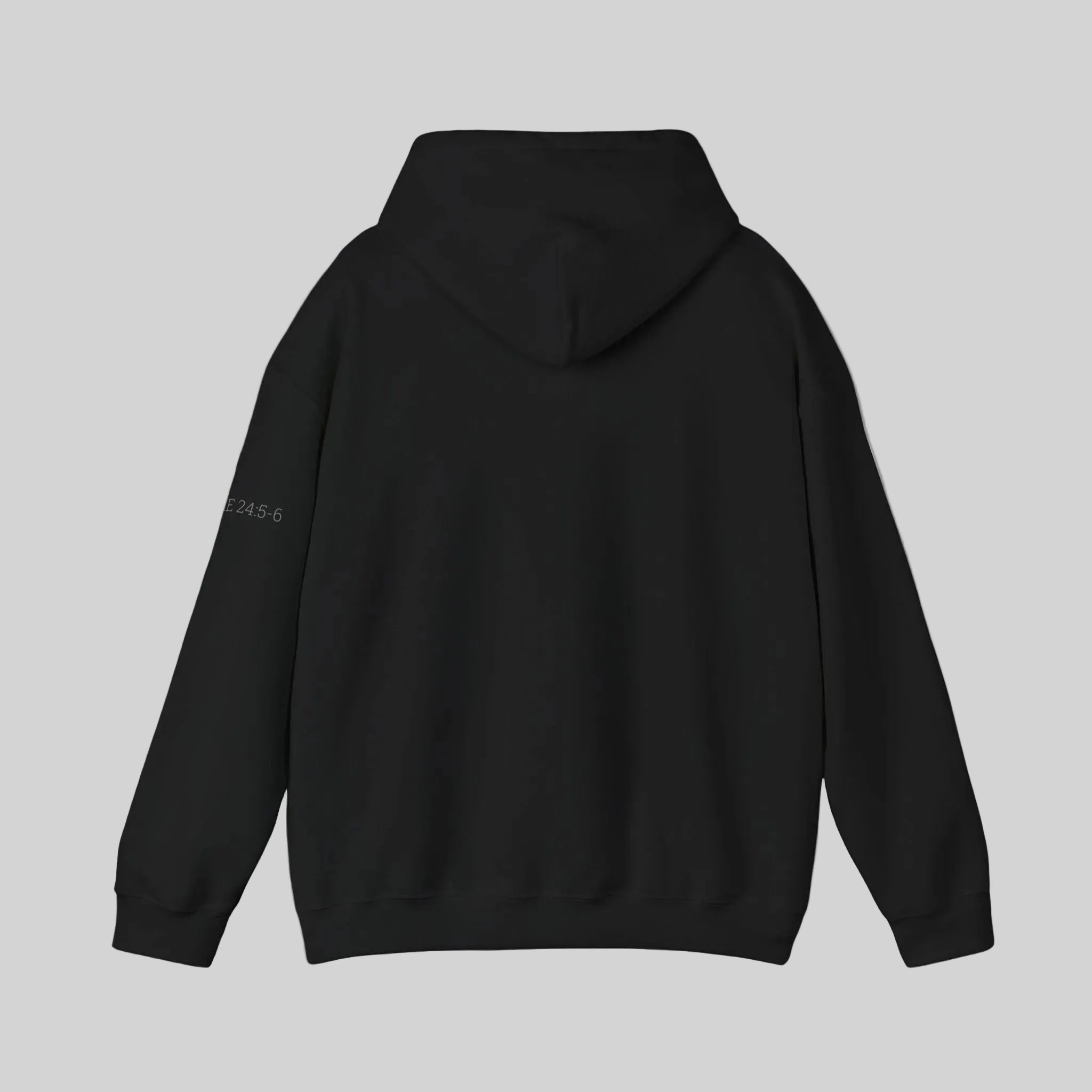 Back of black hoodie against a white background