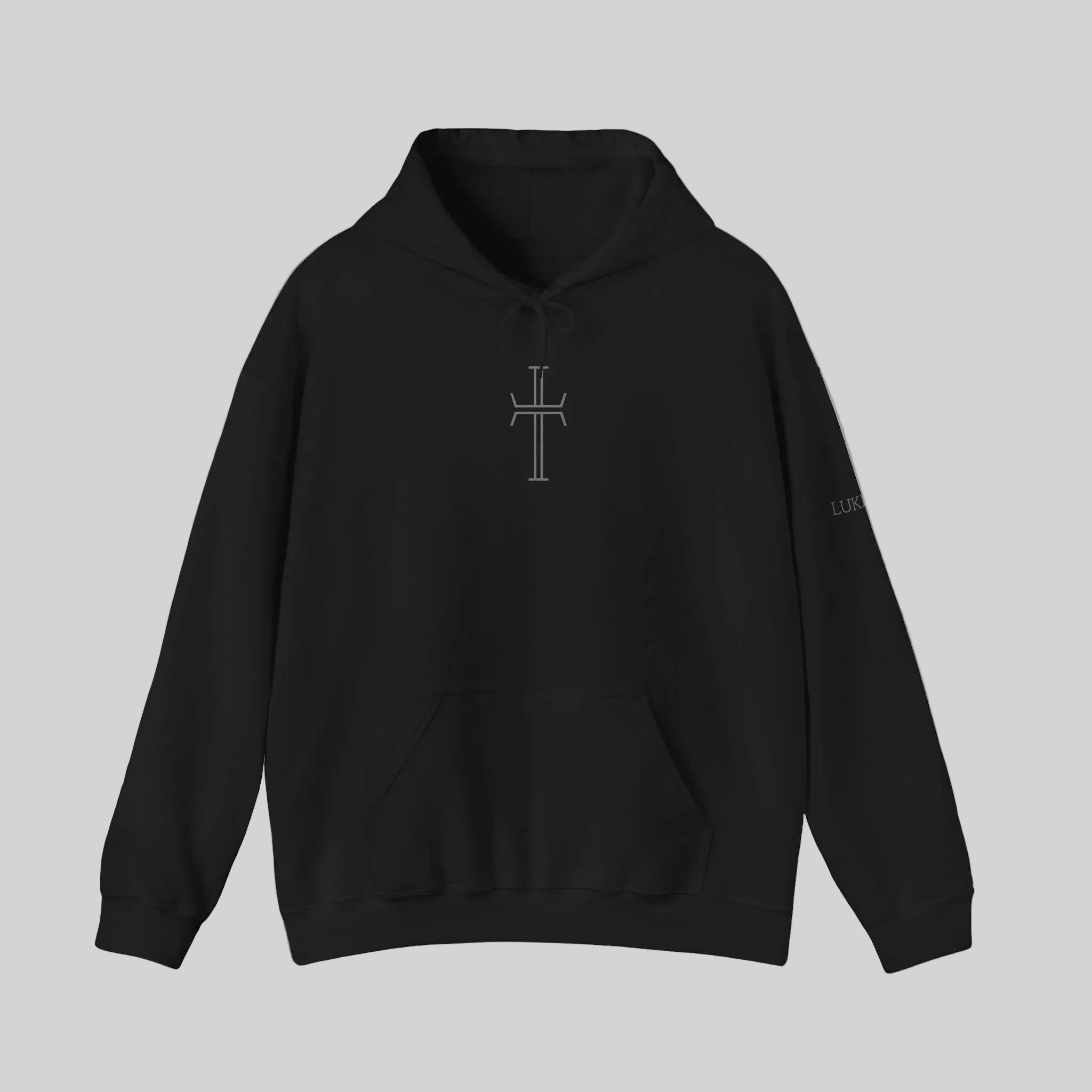 A black hoodie with a cross on the chest against a white background