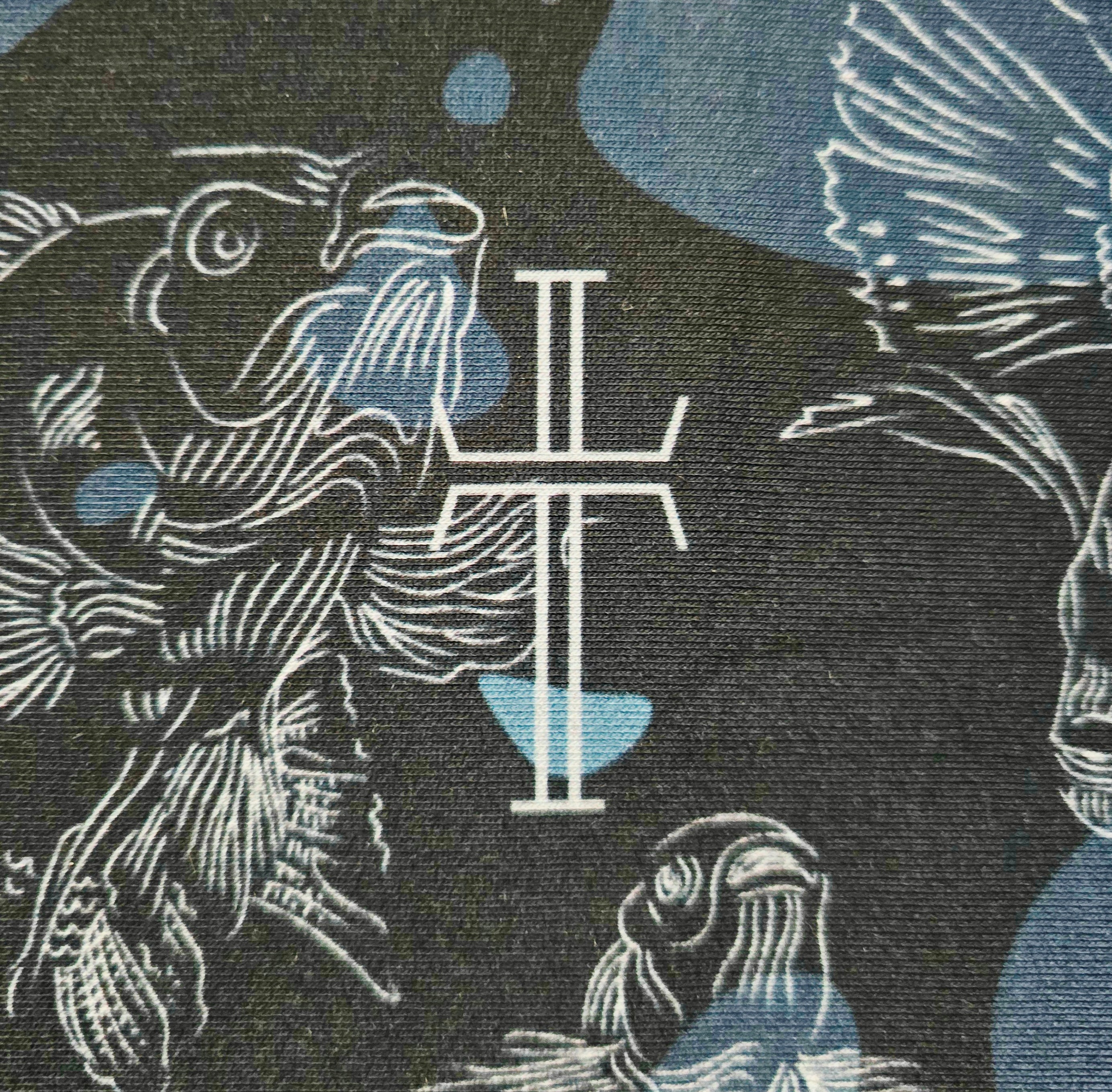 Patterned fabric with swimming carp pattern and a central crucifix symbol on a dark background