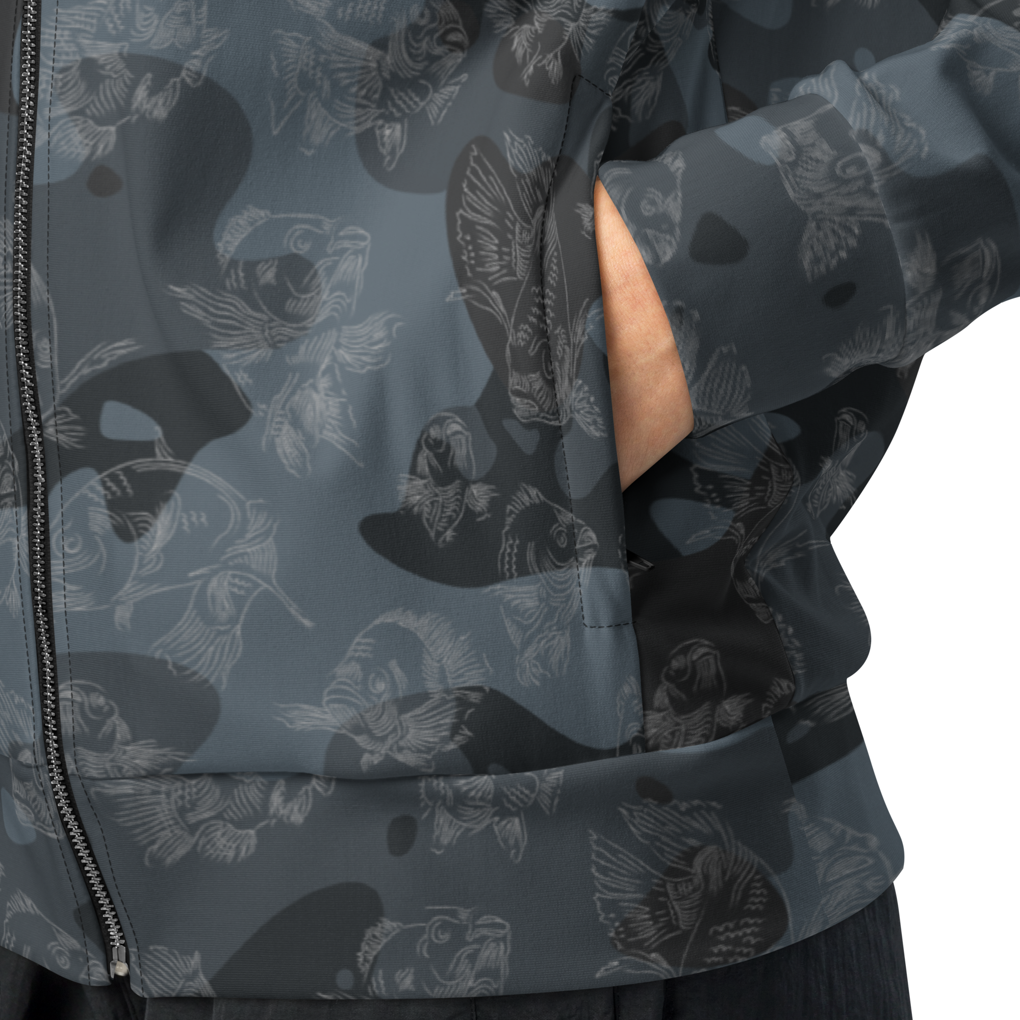 Close-up of a dark gray jacket with a subtle pattern of birds and shapes on a light gray background.