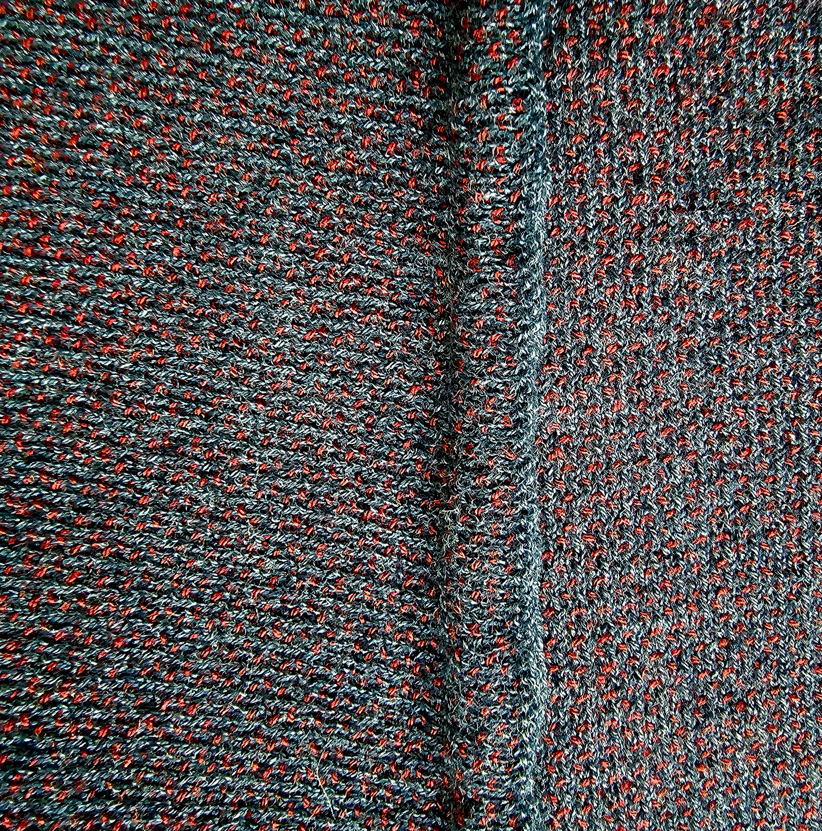 Close-up of the finished seaming of the knitted sweater.