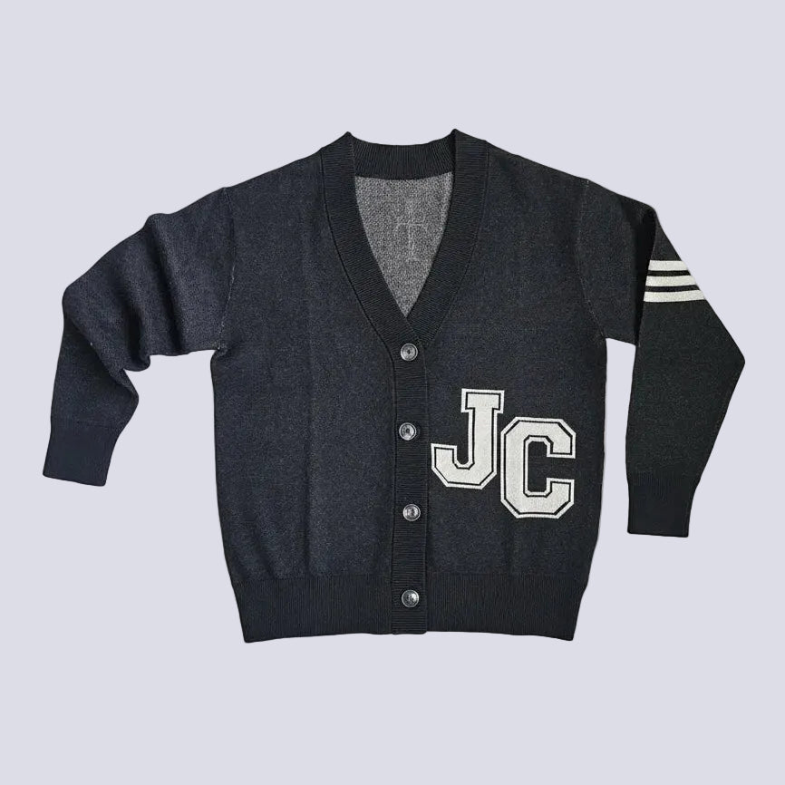 A dark gray knit cardigan sweater with a V-neck, button closure, 'JC' varsity lettering on the chest, and three white stripes on the sleeve, laid flat against a light gray background.