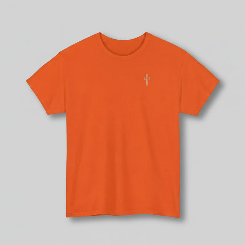 Orange t-shirt with a white cross on a gray background