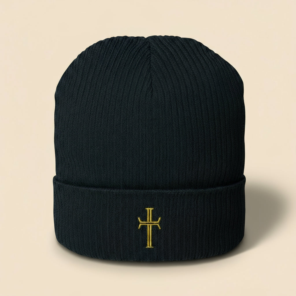 navy-colored knit beanie with embroidered crucifix