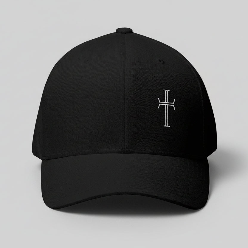 Front of black cap with a white cross on gray background