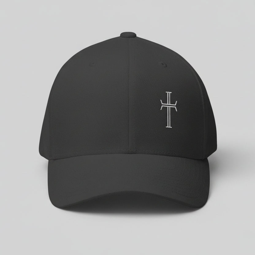 Dark gray baseball cap with a white cross on front left panel against a gray background