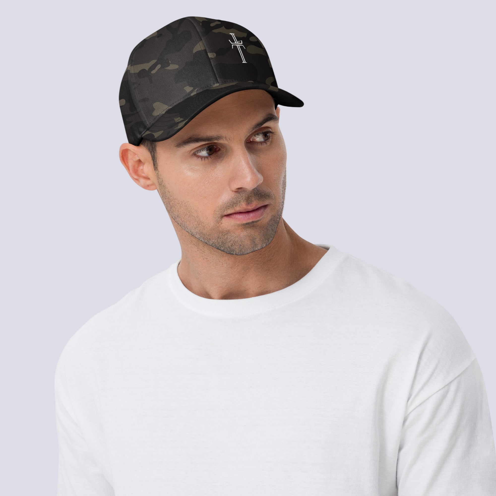 Man wearing a camouflage baseball cap with a cross on a white background