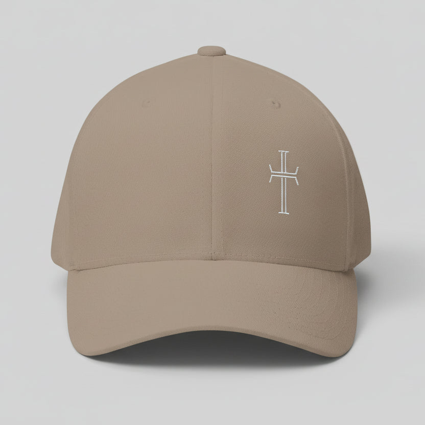 Khaki baseball cap with embroidered white cross on left front panel against a gray background