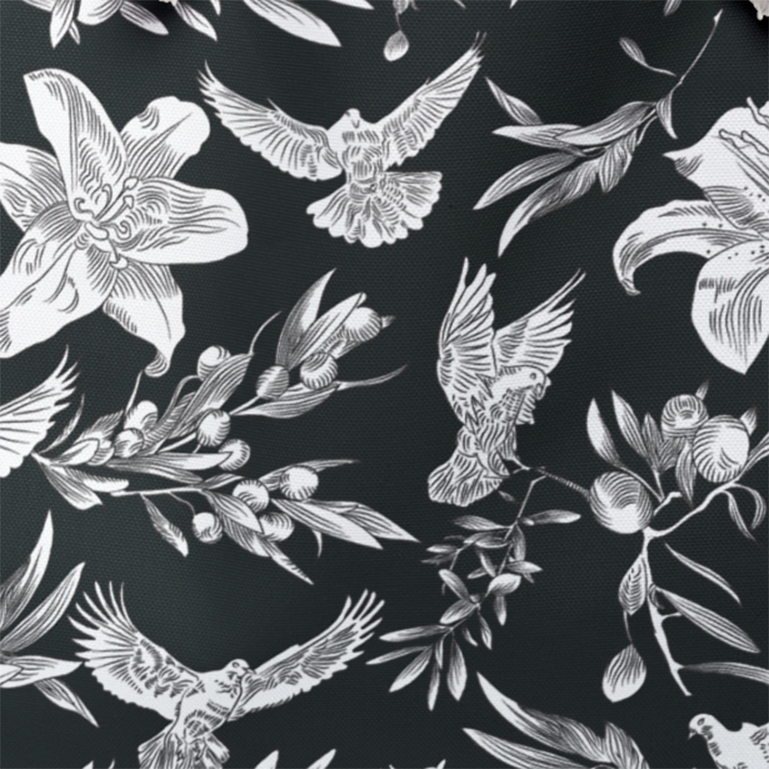 A close-up of the dove, lily, and olive branch pattern against the black background. The subtle woven pattern of the canvas fabric can be seen.